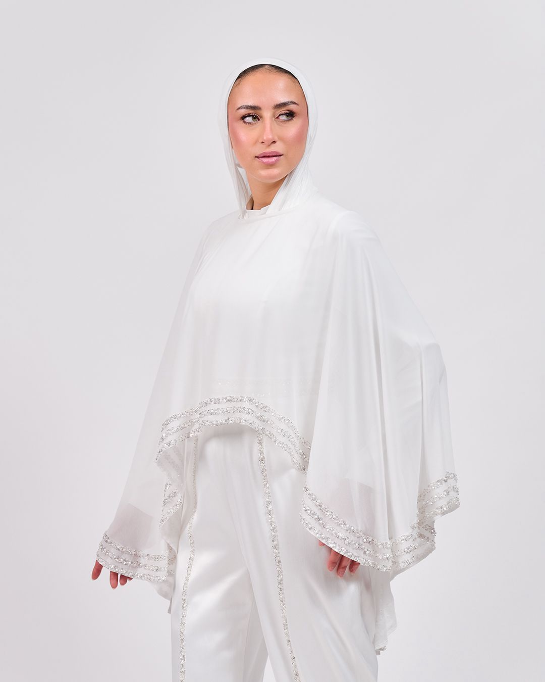 The Refined White Jumpsuit with Embroidered Cap