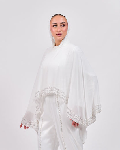 The Refined White Jumpsuit with Embroidered Cap