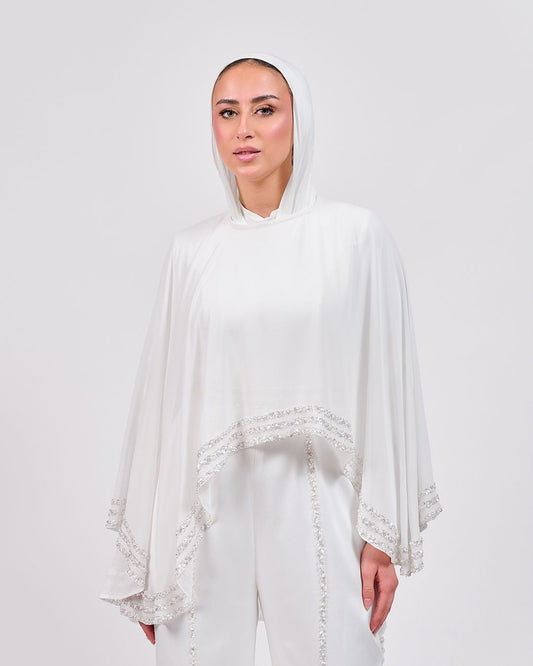 The Refined White Jumpsuit with Embroidered Cap