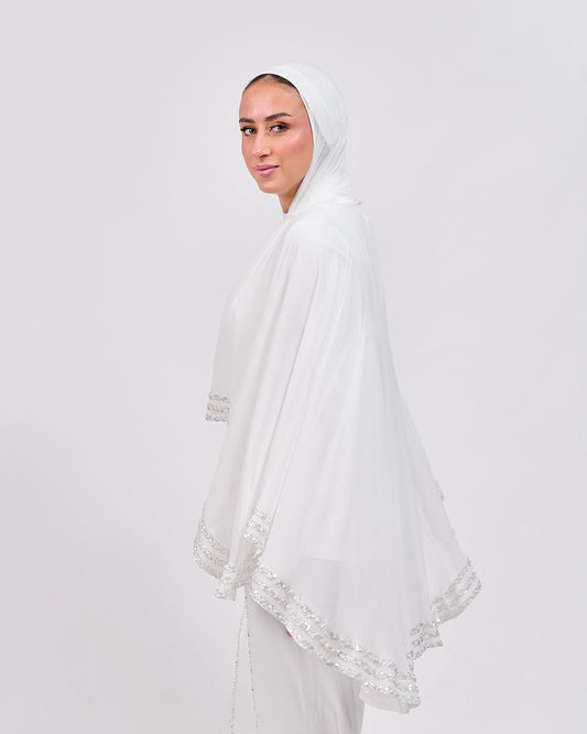 The Refined White Jumpsuit with Embroidered Cap