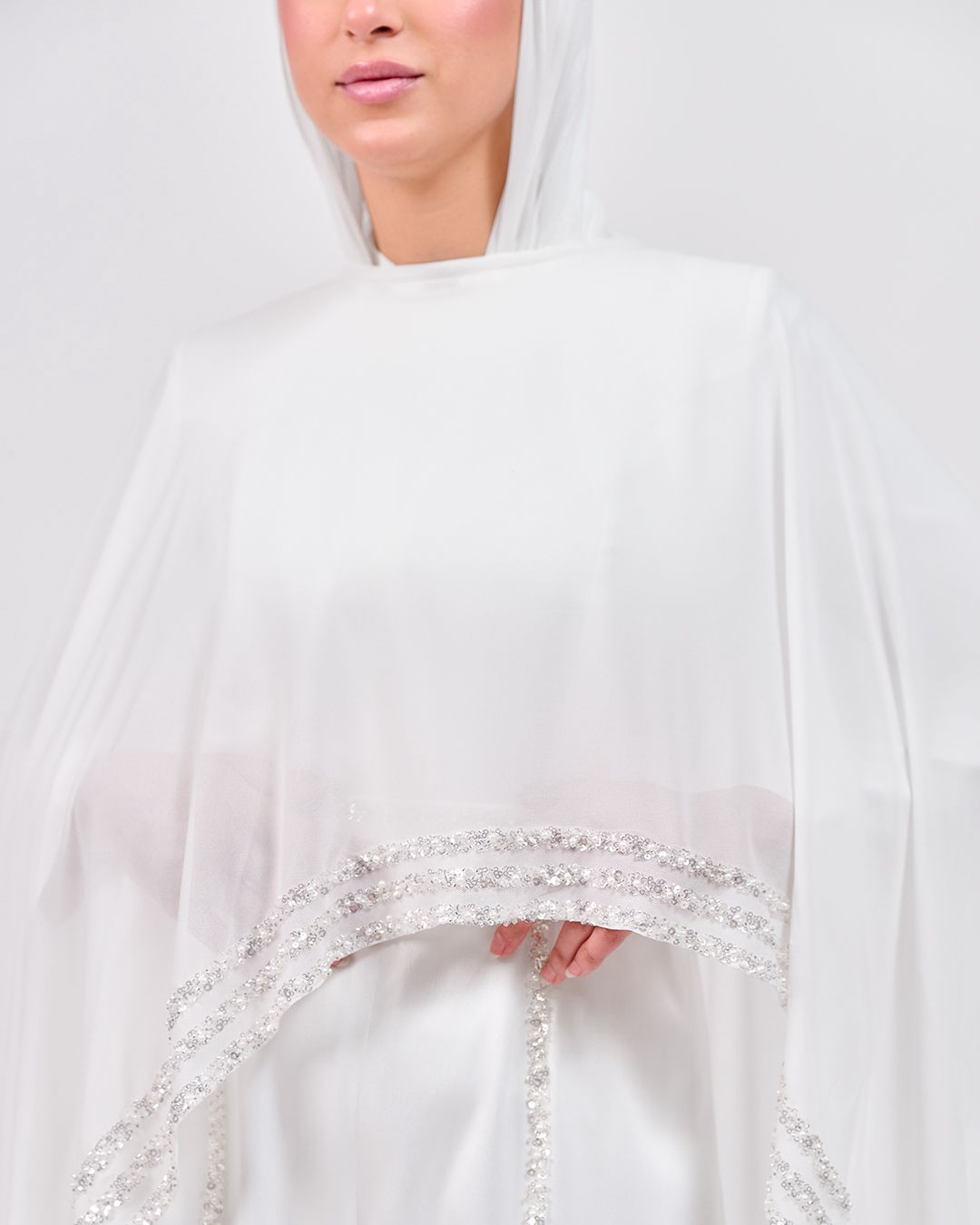 The Refined White Jumpsuit with Embroidered Cap