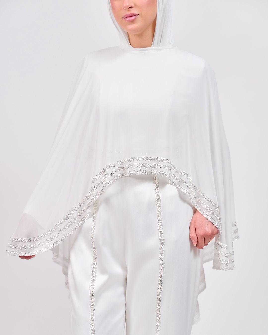 The Refined White Jumpsuit with Embroidered Cap