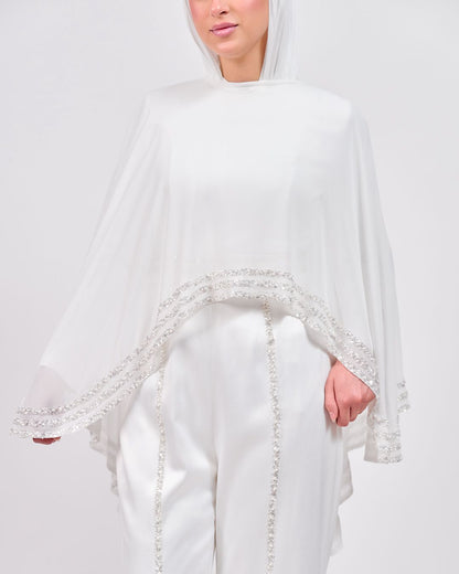 The Refined White Jumpsuit with Embroidered Cap