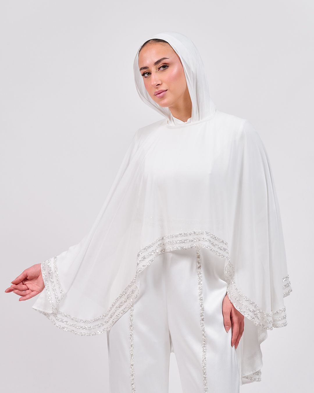 The Refined White Jumpsuit with Embroidered Cap